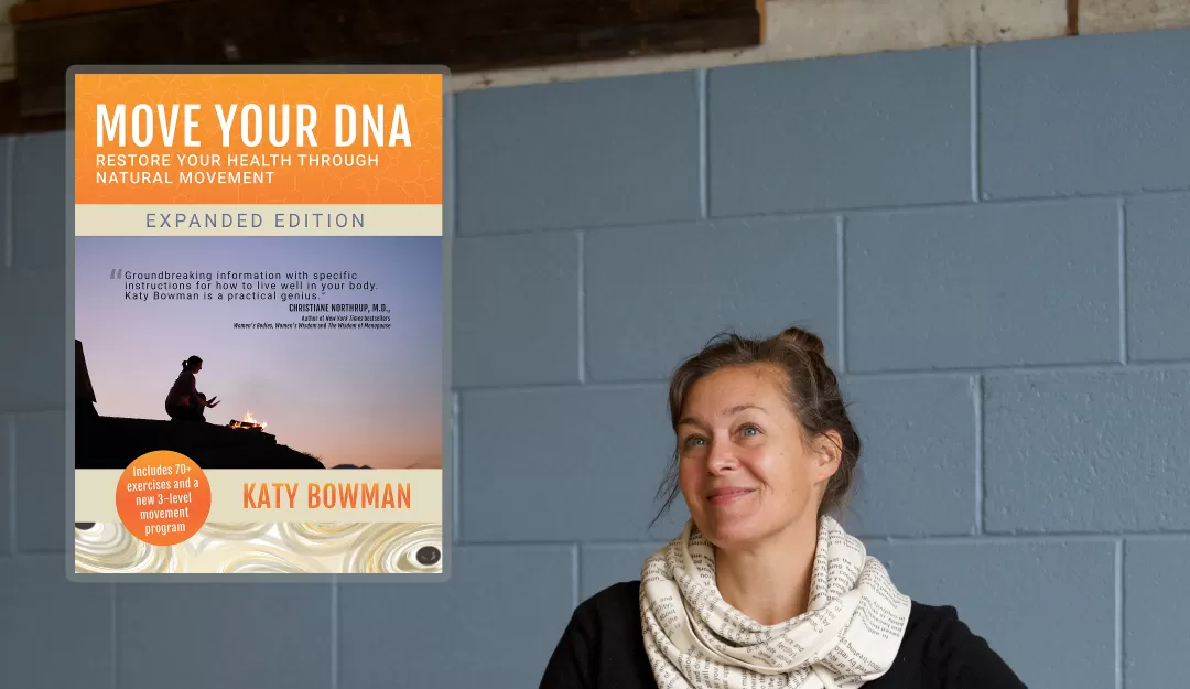 Katy Bowman in an exercise studio wearing a white scarf and black, long sleeve shirt against a light blue cinder-block wall. On the left are cover images for two of her books. The top one is "Move Your DNA" the bottom one is "Grow Wild."